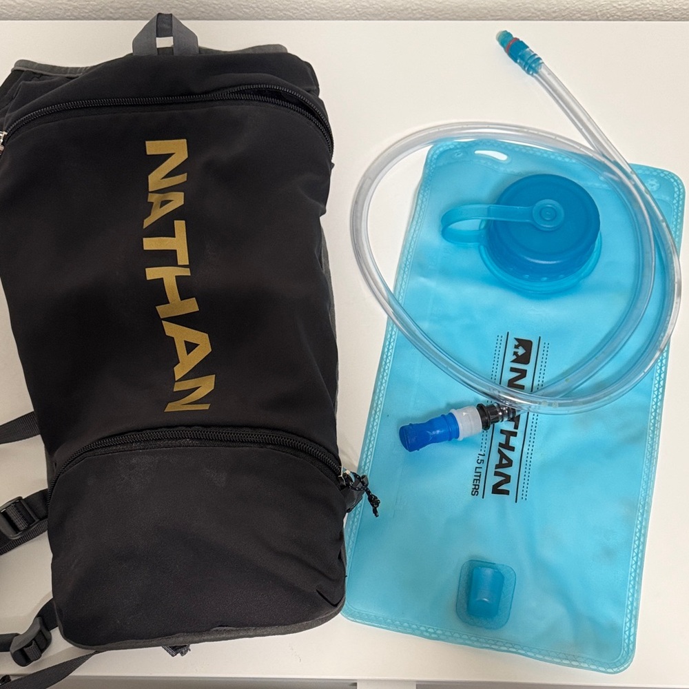 Nathan Black Hydration Backpack with Gold Accents